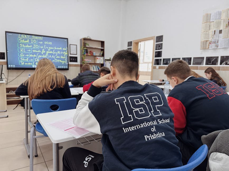 IB IGCSE AP 比較：Students attentively learning in a classroom at the Internat